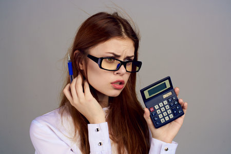 Business woman secretary working calculator office professionalの写真素材