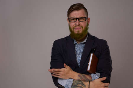 business man with glasses with tattoos on his arms office professionalsの写真素材