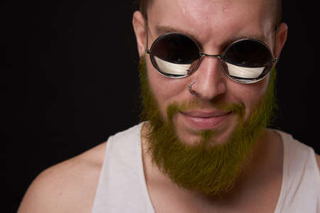 cheerful bearded man in white t-shirt sunglasses posingの写真素材
