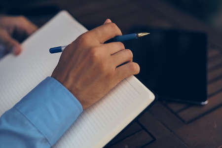 Notepad laptop work in a cafe outdoorsの写真素材