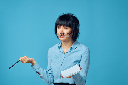 Business woman with notepad and pen wearing glasses secretary