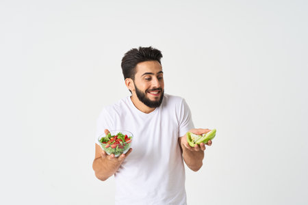 man in white t-shirt plate salad health vegetables