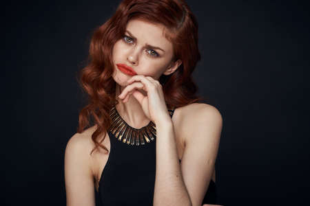 woman in black dress attractive look glamor posing charmの写真素材