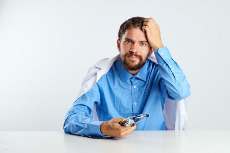 laboratory assistant sitting at his desk experiment analyzes medicineの写真素材