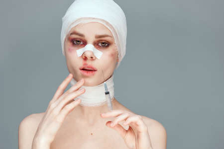 female patient plastic surgery operation bare shoulders isolated backgroundの写真素材