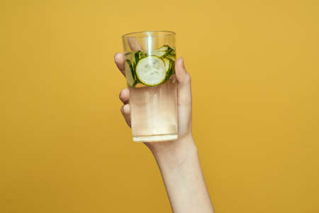 cucumber Fresh vitamins detoxification yellow background cosmetologyの写真素材