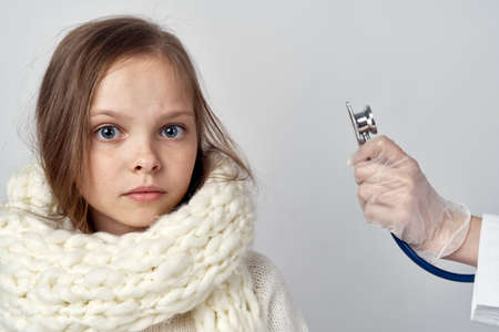 girl with white scarf medicine cure coldの写真素材