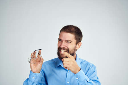 bearded man manager work emotions posing light backgroundの写真素材