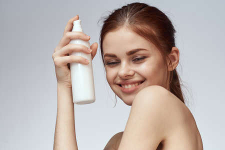 woman with lotion in hands clean skin care health close-upの写真素材
