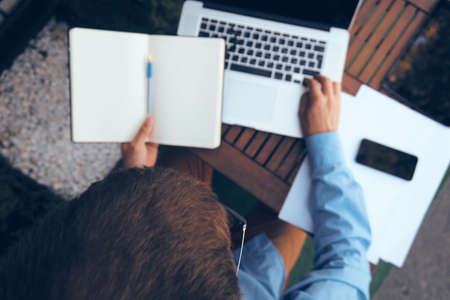 business man with laptop in cafe working internetの写真素材