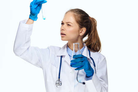 female doctor white coat research analyzes laboratory diagnosticsの写真素材