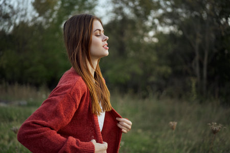 pretty woman in red sweater outdoors walk leisure