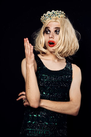 a man in a black dress with a crown on his head transvestite fashion lgbt community