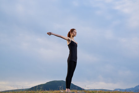 sportive woman workout meditation in the mountains outdoors