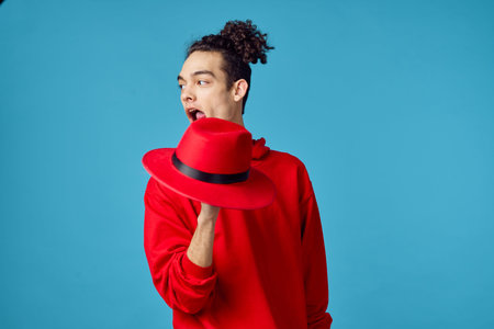 curly guy in a red sweater posing fashion modern hipster style