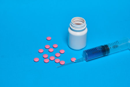 pain reliever vitamins capsules medicine blue background