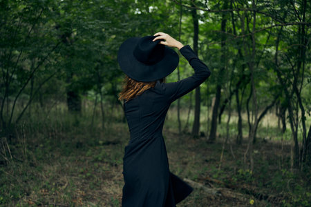 cheerful woman witch in the forest posing fantasyの写真素材