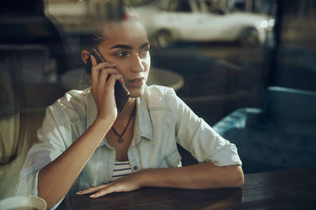 Business woman with phone in cafe vacation breakfastの写真素材