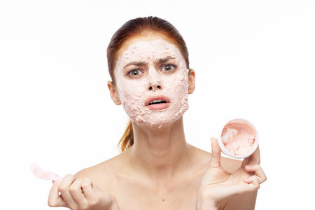 woman with face mask bare shoulders clear skin rejuvenation beautyの写真素材
