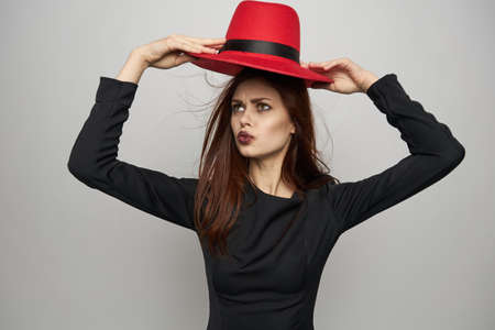 woman in a red hat black lipstick emotions witchの写真素材