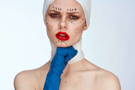 beautiful woman Red lips plastic surgery operation bare shoulders light backgroundの写真素材
