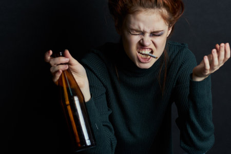 woman with fingal capital smokes a cigarette depression abuseの写真素材