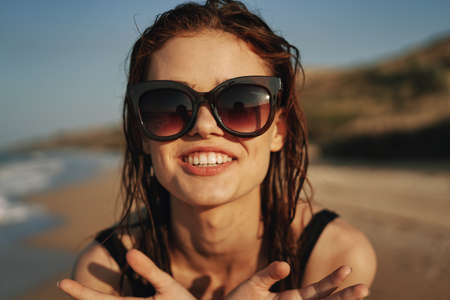 pretty woman in black swimsuit beach nature sunの写真素材