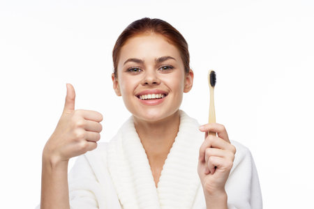 cheerful woman in a white robe facial care rejuvenation lifting