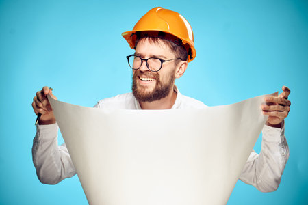 man in orange helmet construction engineer working professional
