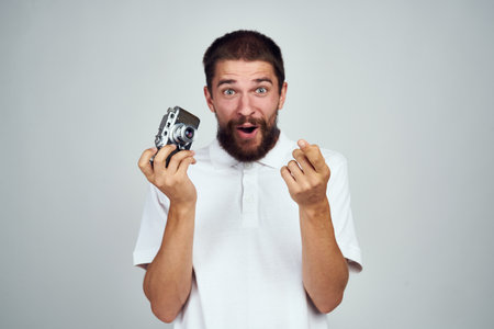 male photographer in glasses with a camera professionals modern styleの写真素材
