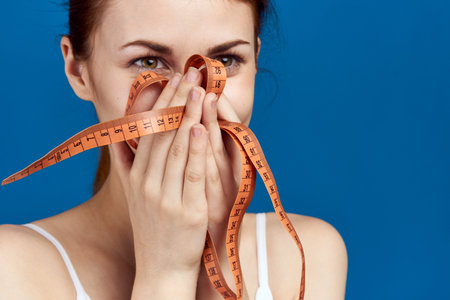 sports woman measuring tape diet body care