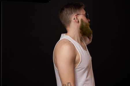 bearded man in white t-shirt with tattoos on his arms posing bullyの写真素材