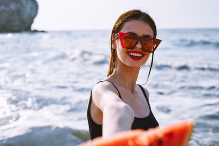 cheerful pretty woman in black swimsuit watermelon fashion travel