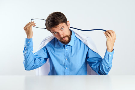 laboratory assistant sitting at his desk experiment analyzes medicine