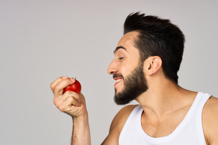 bearded man fresh tomatoes healthy lifestyle diet food studio lifestyleの写真素材
