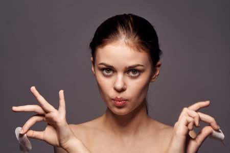pretty woman with bare shoulders and cosmetology clean skin