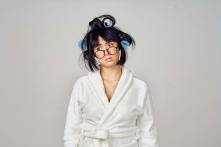 housewife in white robe kitchenware isolated backgroundの写真素材