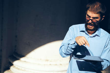 manager with glasses in his hands on the streetの写真素材