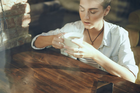 woman in the morning in a cafeの写真素材