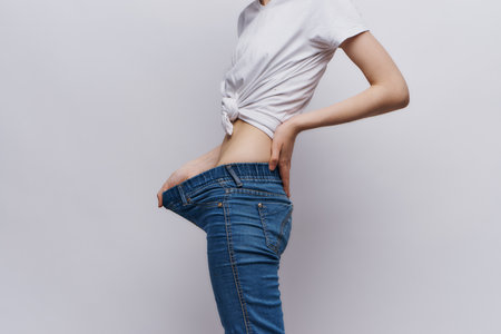 woman measure waist slim figure diet lifestyleの写真素材