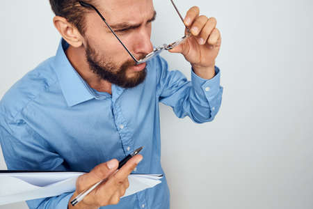 business man in blue shirt documents manager office professionalの写真素材