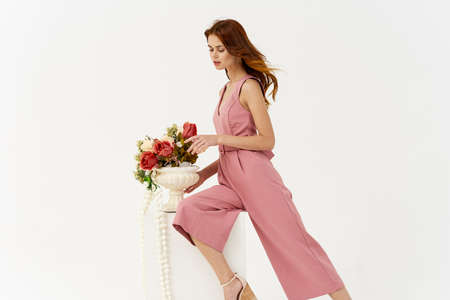 pretty woman in pink dress decoration posing modelの写真素材