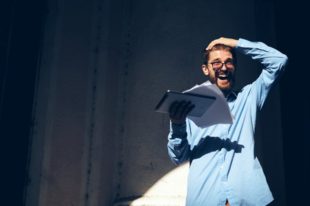 funny business man with a tablet in his hands internetの写真素材