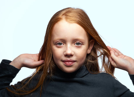 red-haired girl in a black sweater planning close-up
