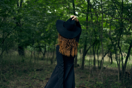 cheerful woman witch in the forest posing fantasyの写真素材