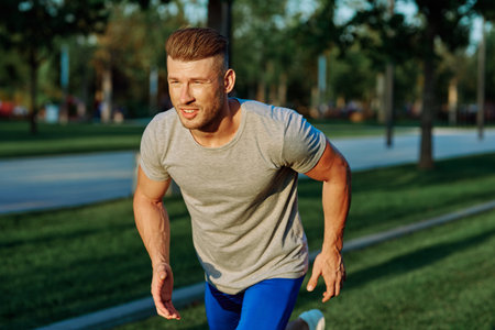 athletic man in the park workout jogging exercise summer