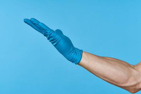 rubber gloves on the hands of a man cleaning