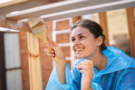 women paint wooden structures brush painter decoration