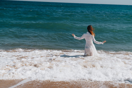 Woman in white dress freedom walk on ocean island
