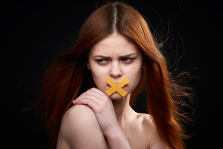 woman with bare shoulders taped mouth banned from diet